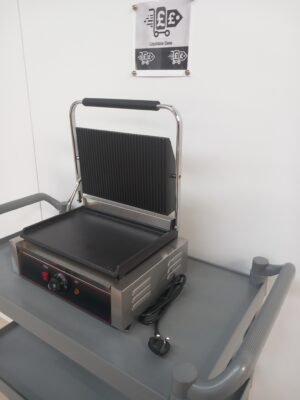 Right side view of a commercial panini grill with the lid open, grooved top plate, flat bottom plate, and plug visible, highlighting easy plug-in installation for quick setup in commercial kitchens.