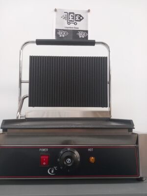 Front view of a commercial grooved top flat bottom panini grill with the lid open, featuring user-friendly temperature controls, ready indicator lights, and high-quality cooking plates for versatile sandwich grilling.