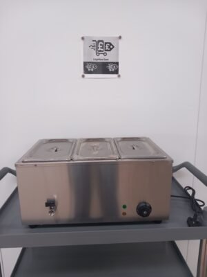 Front view of a commercial 3-pot bain marie with lids on, displaying the user-friendly control panel and water drainage tap for efficient food warming and easy water disposal in catering environments.