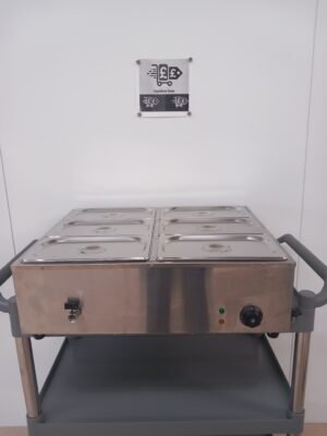 Front view of a commercial 6-pot bain marie with all lids on, featuring the user-friendly temperature controls and accessible water drainage tap for hassle-free operation in commercial kitchens.