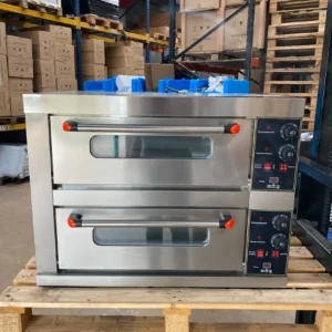 Front view of a large commercial pizza oven with dual doors closed and temperature controls visible on the right, featuring durable stainless steel construction and precise heat management for professional kitchens.